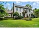 Classic two-story home with brick chimney and landscaped yard at 1295 Patterson St, China Grove, NC 28023