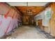 Partially finished garage interior with workbench, insulation, and natural light, perfect for projects at 1295 Patterson St, China Grove, NC 28023