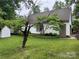 Garage with green grass and mature trees at 1295 Patterson St, China Grove, NC 28023
