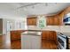 Eat-in kitchen with stainless oven, quartz counter, wood cabinets, and island at 1295 Patterson St, China Grove, NC 28023