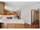 Spacious kitchen features stainless appliances, wood cabinets, and eat-in bar at 1295 Patterson St, China Grove, NC 28023