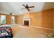 Bright and airy living room with fireplace and ceiling fan at 1295 Patterson St, China Grove, NC 28023