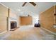 Spacious living room with fireplace and neutral walls at 1295 Patterson St, China Grove, NC 28023