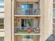 Exterior shot of stacked balconies with colorful seating and tables visible on each at 1315 East Blvd # 410, Charlotte, NC 28203