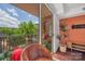 Inviting balcony with comfortable seating, grill, and verdant outdoor view at 1315 East Blvd # 410, Charlotte, NC 28203
