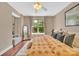 Bright bedroom with a large window, natural light, and a comfortable seating area at 1315 East Blvd # 410, Charlotte, NC 28203