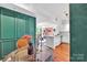 Bright dining nook with rich trimwork, colorful wallpaper, and access to an open-concept layout at 1315 East Blvd # 410, Charlotte, NC 28203