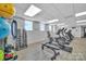 Well-equipped gym showcasing free weights, cardio machines, and large windows at 1315 East Blvd # 410, Charlotte, NC 28203