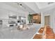 Modern kitchen features a large island with a white countertop and barstool seating at 1315 East Blvd # 410, Charlotte, NC 28203