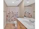 Well-lit bathroom featuring a single vanity with wood cabinets and a shower with decorative curtain at 1315 East Blvd # 410, Charlotte, NC 28203