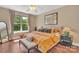 Cozy bedroom with large window and neutral decor at 1315 East Blvd # 410, Charlotte, NC 28203