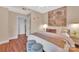 Comfortable bedroom features a large bed with soft pillows and access to the hallway at 1315 East Blvd # 410, Charlotte, NC 28203