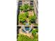 Aerial view of courtyard, a green space with trees, benches, and a circular water feature with stairs at 1315 East Blvd # 410, Charlotte, NC 28203