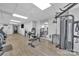 Spacious gym with weight machines, hardwood floors, mirrors, a water cooler, and mounted television at 1315 East Blvd # 410, Charlotte, NC 28203