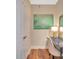 Hallway featuring decorative painting, desk with chair, and access to other rooms at 1315 East Blvd # 410, Charlotte, NC 28203