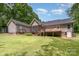 The home features a back deck and screened-in porch, perfect for outdoor entertainment, with a private backyard at 1318 Candlewood Dr, Gastonia, NC 28052