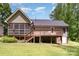 The backyard includes a raised deck and screened-in porch, great for enjoying the outdoors, with lush landscaping at 1318 Candlewood Dr, Gastonia, NC 28052