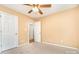 Cozy bedroom featuring a ceiling fan, plush carpeting, and access to an adjoining room, with neutral paint at 1318 Candlewood Dr, Gastonia, NC 28052