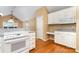 Kitchen features white cabinets, granite counters, and stainless oven range at 1318 Candlewood Dr, Gastonia, NC 28052