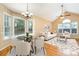 Bright and airy living room with elegant dining area, vaulted ceilings, and abundant natural light at 1318 Candlewood Dr, Gastonia, NC 28052