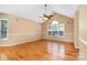 Open living space with hardwood floors, vaulted ceiling, and large windows, ideal for entertaining and relaxation at 1318 Candlewood Dr, Gastonia, NC 28052