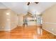 Open-concept living space with hardwood floors, vaulted ceilings, and seamless transition to the kitchen area at 1318 Candlewood Dr, Gastonia, NC 28052