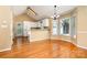 Bright living area with hardwood floors, vaulted ceilings, and a seamless transition to a modern kitchen at 1318 Candlewood Dr, Gastonia, NC 28052