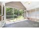 The home features a screened porch overlooking a private, wooded backyard with plenty of space for outdoor activities at 1318 Candlewood Dr, Gastonia, NC 28052
