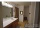 Bathroom with large vanity and separate toilet and tub area at 1332 Waterlily Ln, Charlotte, NC 28262