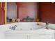 Jetted bathtub with tile surround, perfect for relaxation and enjoyment at 1332 Waterlily Ln, Charlotte, NC 28262