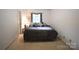 Bedroom with neutral colored walls, carpeted flooring and a window for natural light at 1332 Waterlily Ln, Charlotte, NC 28262
