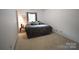 Bedroom with neutral colored walls, carpeted flooring and a window for natural light at 1332 Waterlily Ln, Charlotte, NC 28262