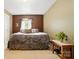 Bedroom with a queen sized bed, warm neutral toned walls and a large window providing natural light at 1332 Waterlily Ln, Charlotte, NC 28262