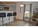 Breakfast nook with barstool seating, stainless steel appliances, and abundant natural light at 1332 Waterlily Ln, Charlotte, NC 28262