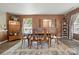 Inviting dining room featuring modern flooring, a stylish rug, and an abundance of natural light at 1332 Waterlily Ln, Charlotte, NC 28262