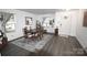 Bright dining room with modern flooring, a large window, and stylish décor at 1332 Waterlily Ln, Charlotte, NC 28262