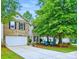 Charming two-story home featuring a brick facade, a two-car garage and a well maintained front yard at 1332 Waterlily Ln, Charlotte, NC 28262