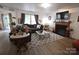 Bright and spacious living room featuring hardwood floors and a fireplace at 1332 Waterlily Ln, Charlotte, NC 28262