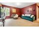 Comfortable living room with turquoise sofa, plush chair, and light-filled window at 1332 Waterlily Ln, Charlotte, NC 28262