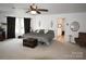 Large main bedroom with ceiling fan and a wooden chest at the end of the bed at 1332 Waterlily Ln, Charlotte, NC 28262