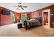 Spacious main bedroom with multiple windows, ceiling fan, and en-suite bathroom at 1332 Waterlily Ln, Charlotte, NC 28262