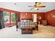Bright main bedroom featuring a plush carpet, a decorative trunk, and an inviting atmosphere at 1332 Waterlily Ln, Charlotte, NC 28262