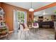 Charming sitting area with cozy chairs, decorative accents, and natural light streaming through the window at 1332 Waterlily Ln, Charlotte, NC 28262