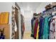 Bright walk-in closet with shelving and plentiful storage for clothes and accessories at 1332 Waterlily Ln, Charlotte, NC 28262