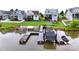 A beautiful waterfront property features a dock, lake access, and a well-manicured lawn at 136 Preston Rd, Mooresville, NC 28117