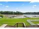 A lush green backyard features direct lake access and a personal boat dock at 136 Preston Rd, Mooresville, NC 28117