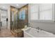 Luxurious bathroom featuring a standalone tub, glass shower, and modern fixtures for a spa-like experience at 136 Preston Rd, Mooresville, NC 28117