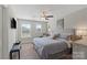 Calming bedroom featuring a cozy bed, neutral tones, soft lighting, and windows for a serene atmosphere at 136 Preston Rd, Mooresville, NC 28117