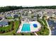 Aerial view of a neighborhood pool with a clubhouse, lounge chairs, and manicured landscaping at 136 Preston Rd, Mooresville, NC 28117