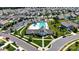 Stunning aerial view of a community pool, clubhouse, and well-maintained neighborhood streets at 136 Preston Rd, Mooresville, NC 28117